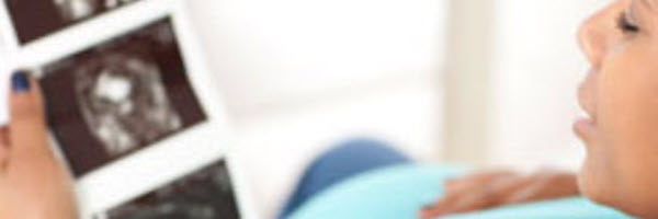 mom-with-infant-looking-at-cell-phone